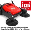 A red and black manual sweeper machine with large brushes, shown from a diagonal front view. A red overlay in the top right corner displays '105 cm' with arrows indicating width. Text at the bottom provides operational information. Produktbild-Vorschau