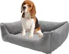 A beagle dog sitting in a gray dog bed. Podgląd zdjęcia produktu