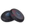 Two black ear pads with blue accents and a blue logo are shown against a white background. Produktbild-Vorschau