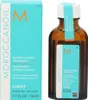 A product shot of Moroccanoil Treatment Light hair oil and its packaging. Náhled obrázku produktu