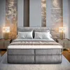 A well-lit bedroom with a large bed as the focal point. Produktbild-Vorschau