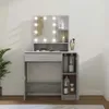A vanity table with a lighted mirror and storage compartments. Produktbild-Vorschau