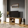 A modern living room with a TV stand, TV, and decor. Náhled obrázku produktu