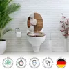 A toilet with a decorative lid and seat in a bathroom setting. Produktbild-Vorschau