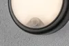A close-up view of an outdoor wall light with a motion sensor. Produktbild-Vorschau