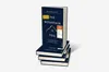A stack of books with the top book standing upright. Náhľad obrázku produktu