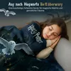 A young girl is sleeping peacefully under a Harry Potter themed blanket, with a snowy owl flying in the background. Produktbild-Vorschau