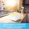A white container with yellow contents sits on a wooden countertop next to a window with sunlight streaming in. Voir les images du produit