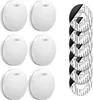 A set of six smoke detectors and several adhesive mounting pads are displayed on a white background. Produktbild-Vorschau