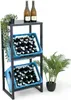 A metal shelving unit with two blue crates filled with bottles, topped with two bottles of wine and a small plant. Podgląd zdjęcia produktu