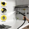 A hand holding a yellow and black steam cleaner in a kitchen setting, with steam coming out of the nozzle. There are also inset images highlighting product features. Produktbild-Vorschau