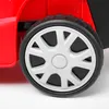 A close-up of a red lawnmower wheel. Produktbild-Vorschau