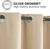 Close-up of beige outdoor curtains with silver grommets hanging on a dark curtain rod. Produktbild-Vorschau