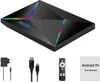A black Android TV box with colorful LED accents, along with its accessories and manual, displayed on a white background. Podgląd zdjęcia produktu
