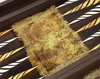A close-up view of a backgammon board with an antique map design. Produktbild-Vorschau