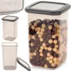 A set of transparent food storage containers with gray lids, one of which is filled with cereal. Anteprima dell’immagine prodotto
