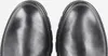 A close-up top-down view of the toe caps of two black leather boots. Produktbild-Vorschau