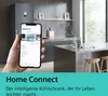A hand holding a smartphone displaying the Home Connect app in front of a modern kitchen with a refrigerator and island. Podgląd zdjęcia produktu