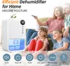 A family is sitting on a couch watching TV, with a dehumidifier in the foreground. Produktbild-Vorschau