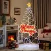 A decorated living room with a fireplace, Christmas tree, and Santa Claus figure. Podgląd zdjęcia produktu
