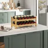 A wooden wine rack filled with red wine bottles sits on a kitchen counter. Podgląd zdjęcia produktu