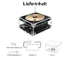 A diagram showing the contents of a package, including a main device, power adapter, and accessories. Produktbild-Vorschau