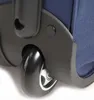 A close-up view of a black wheel and part of a blue fabric suitcase. Produktbild-Vorschau