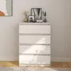 A white wooden chest of drawers with decorative items on top, placed against a light-colored wall. Voir les images du produit