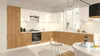 A modern kitchen with white and wood cabinets, a stove, and a dining table. Podgląd zdjęcia produktu