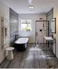 A modern bathroom with a freestanding bathtub, a walk-in shower, and a vanity. Anteprima dell’immagine prodotto