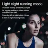 A woman is wearing earbuds while running at night, with blurred city lights in the background. Náhled obrázku produktu