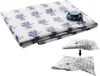 A folded vacuum storage bag with a lavender pattern and a gray valve, shown with a smaller inset image demonstrating its compression. Náhled obrázku produktu