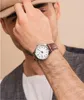 A man wearing a hat and a watch. Produktbild-Vorschau