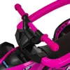 A close-up view of the handlebars and steering mechanism of a pink children's tricycle. Náhled obrázku produktu