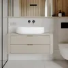 A modern bathroom vanity with a vessel sink and wall-mounted faucets. Anteprima dell’immagine prodotto