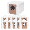 A stack of white vacuum cleaner bags with brown cardboard fronts and black circular openings. Produktbild-Vorschau