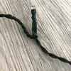 A close-up of a green LED light string with a clear LED bulb. Produktbild-Vorschau