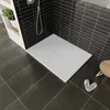 A modern bathroom with a white shower tray and black tiled walls. Produktbild-Vorschau