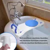A bath seat is placed across a bathtub, with a faucet and showerhead visible. Náhľad obrázku produktu