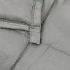 A close-up view of the stitching and fabric of a gray weighted blanket. Náhľad obrázku produktu