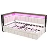 A product shot of a beige upholstered daybed with a metal frame and LED lighting. Voir les images du produit
