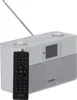 A silver and gray Kenwood internet radio with a remote control in front of it, set against a white background. Anteprima dell’immagine prodotto