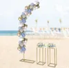 A wedding setup on a beach with a balloon arch and two floral pedestals. Náhled obrázku produktu
