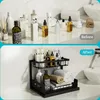 A before and after comparison of bathroom counter organization, showing products on a counter and then neatly arranged on a shelf. Produktbild-Vorschau