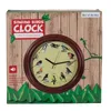The image shows the packaging of a singing birds clock, with the clock itself prominently displayed on the front of the box. Náhled obrázku produktu