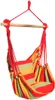 A colorful striped hanging chair suspended from a wooden bar. Produktbild-Vorschau