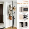 A black coat rack with a coat, hat, handbag, and umbrella is shown in a hallway. Text overlays describe features. Produktbild-Vorschau
