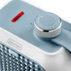 A close-up view of the top section of a De'Longhi mini fan heater, showing the control knob and indicator light. Voir les images du produit