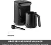 A black Turkish coffee maker with its accessories, including a measuring spoon and a carafe, is displayed against a white background. Text below the image describes its large capacity. Produktbild-Vorschau