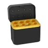 A black and yellow battery charger case with the lid open, showing the charging slots. Produktbild-Vorschau